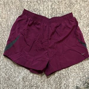 EUC Nike Burgundy with grey detail running shorts with built in liner size small